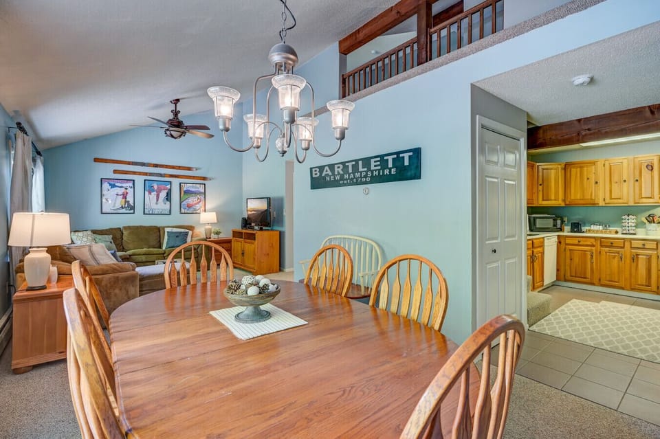 Open dining area, charming ski decor, and easy access to the fully stocked kitchen and the comfy den area..