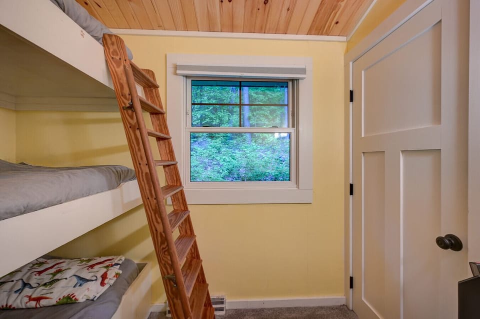 Fun and cozy bunk room with three twin beds—perfect for kids or extra guests.