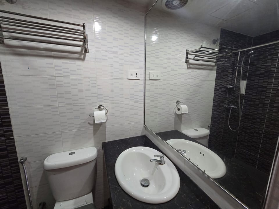 Deluxe Triple Room | Minibar, desk, laptop workspace, iron/ironing board