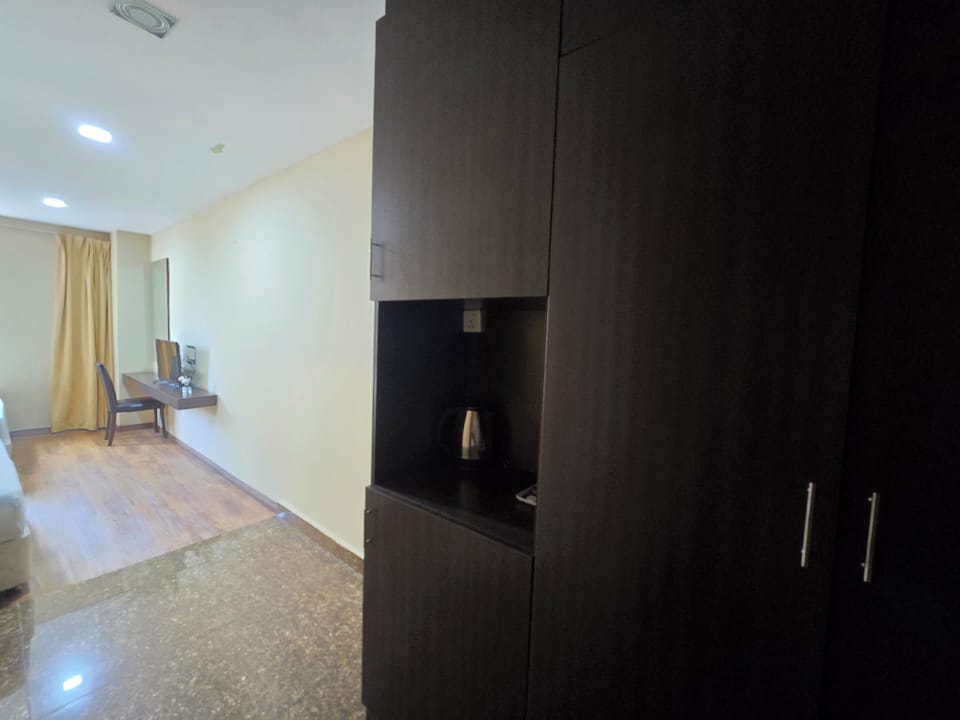Family Room | Minibar, desk, laptop workspace, iron/ironing board