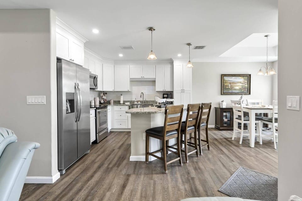 Bright and airy open-concept home with seamless flow between the living, dining, and kitchen areas—perfect for gathering and entertaining.