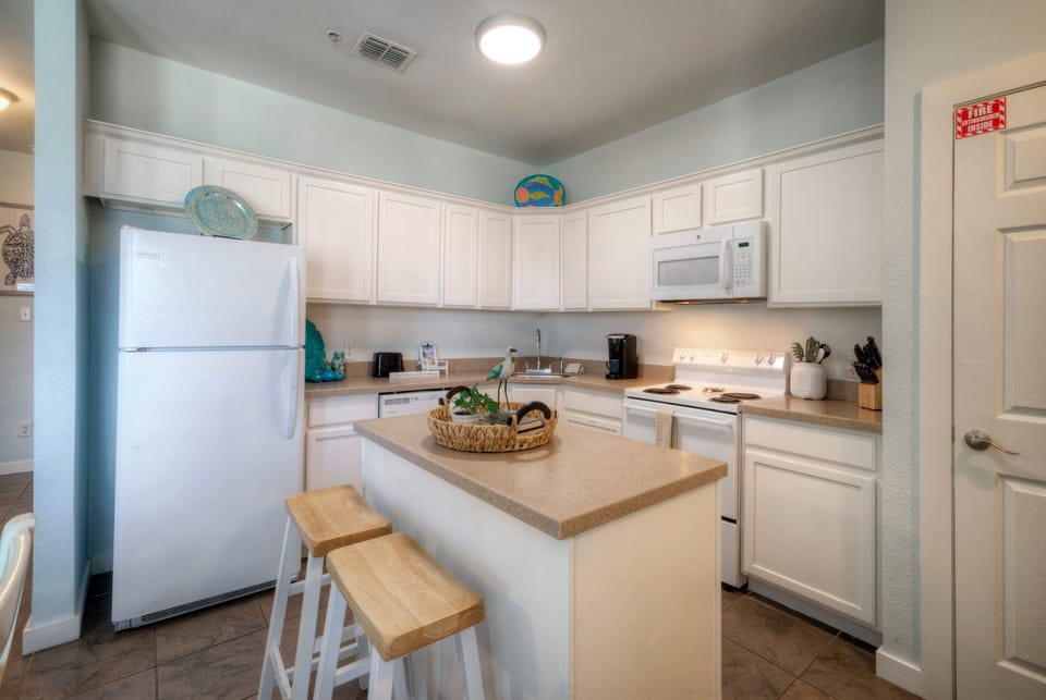 Pull up a stool and enjoy casual dining, morning coffee, or great conversation at the kitchen counter (Unit 101)
