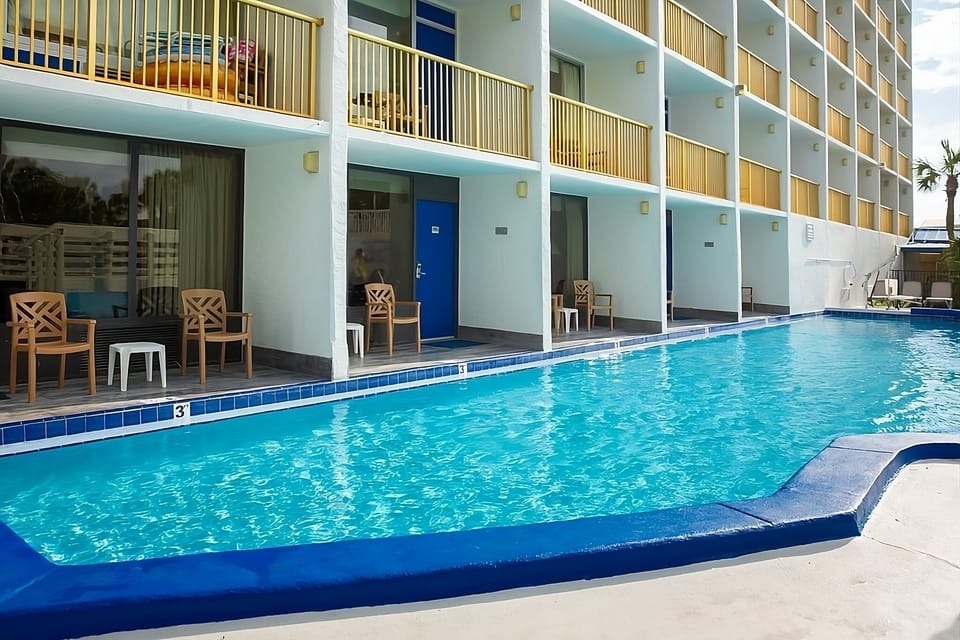 Slip into crystal water steps from your private patio.