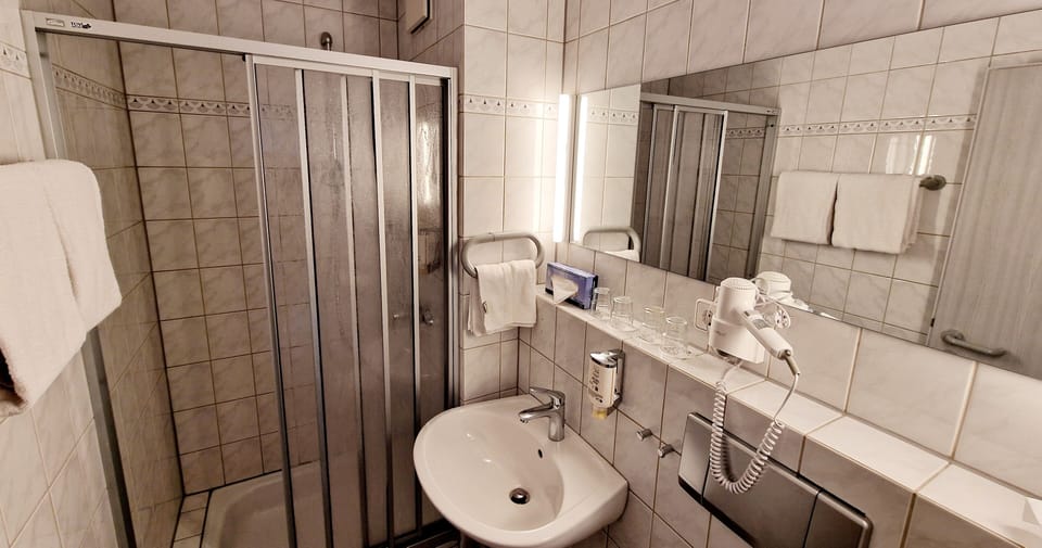 Shower, towels, soap, toilet paper
