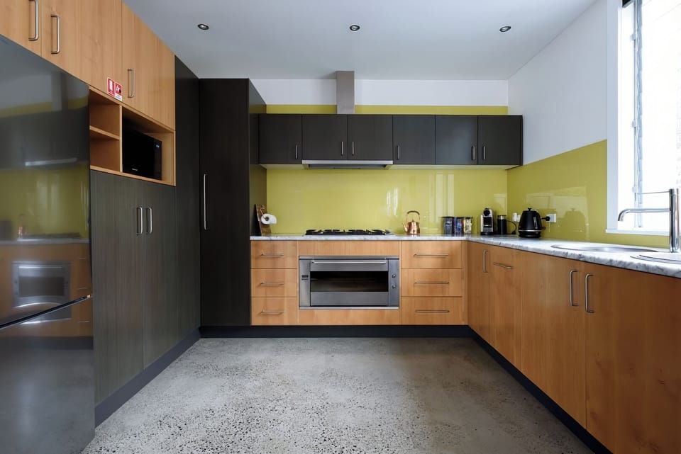 Sleek Kitchen with Vibrant Splashback