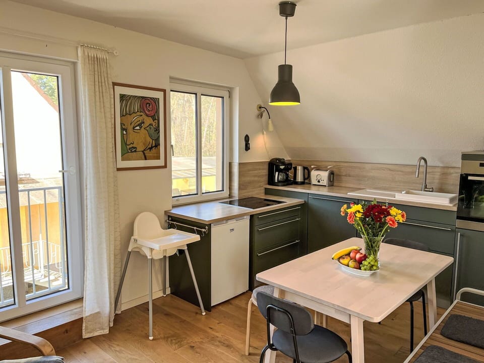 Furniture, Kitchen, Interior Design, Flooring, Wood, Countertop, Chair, Kitchen & Dining Room Table, Floor, Kitchen Appliance