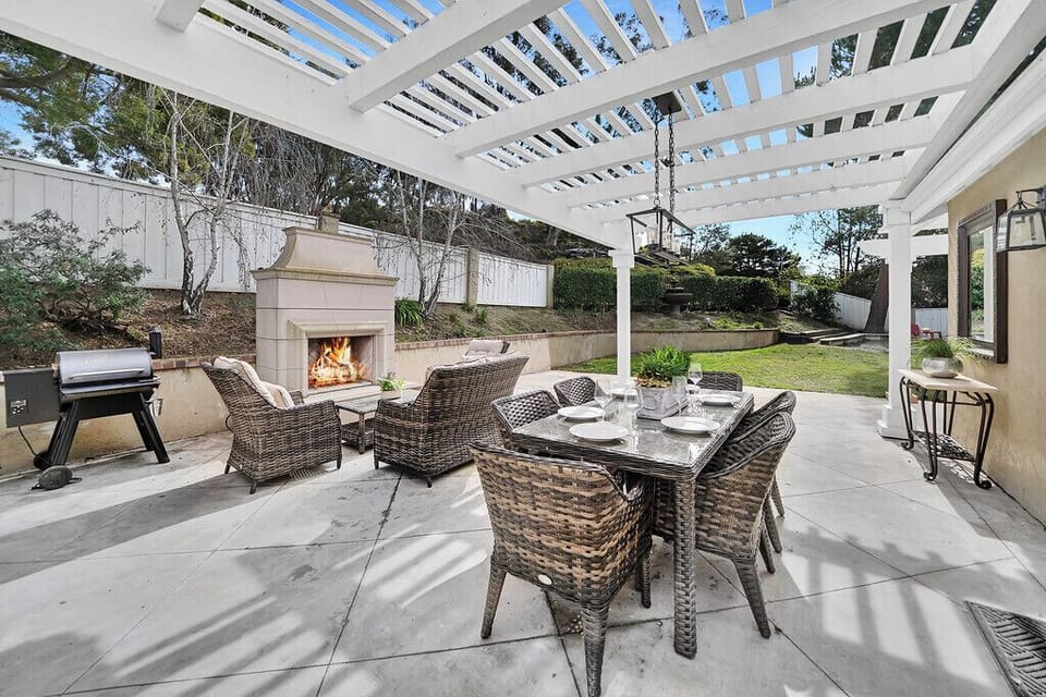 Back yard patio, dining, fireplace and furniture