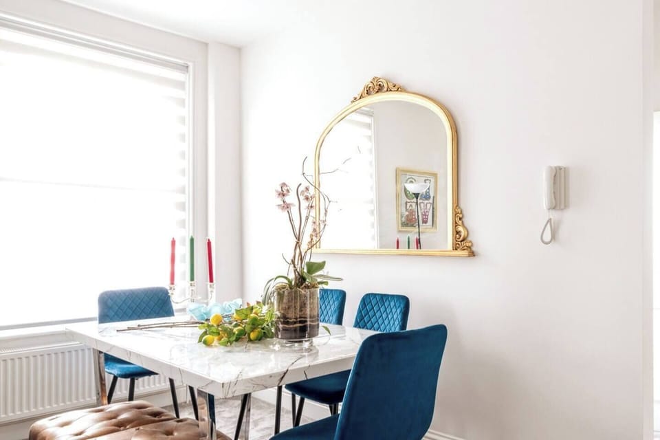 Your your family will fall in love with this dinning area showcasing a blend of functionality and aesthetic appeal with an accent of blue which injects a calm and serene atmosphere.