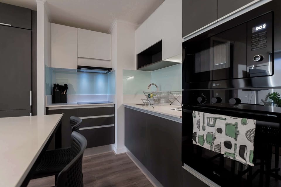 Sleek, modern kitchen with stylish cabinetry and ample counter space, perfect for culinary adventures.