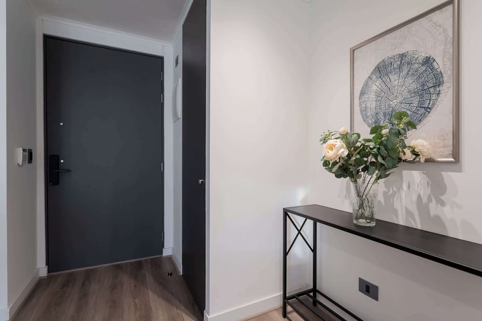 Welcome to your stylish retreat with a modern entryway that sets the tone for a relaxing stay.