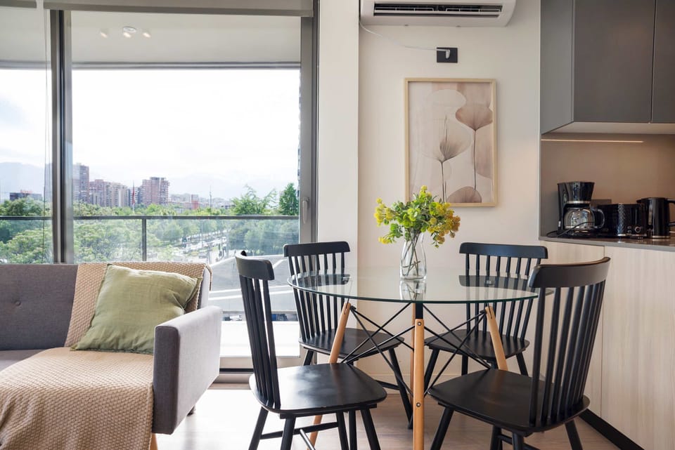 Enjoy stunning city views from this bright and modern living space, perfect for dining and relaxation.