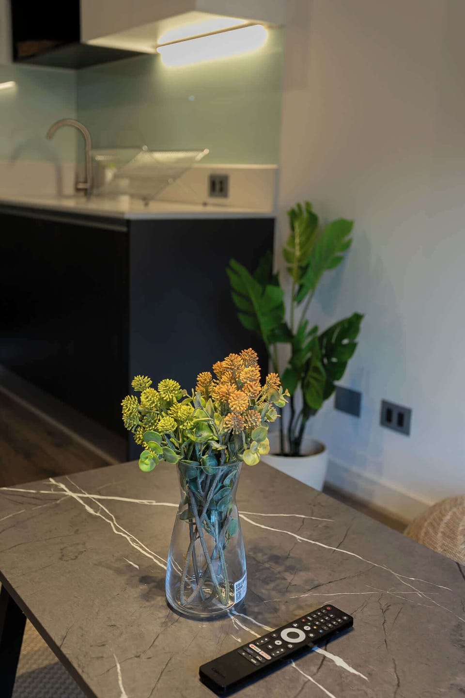 Cozy kitchen corner with modern design and vibrant decor, perfect for a relaxing stay.