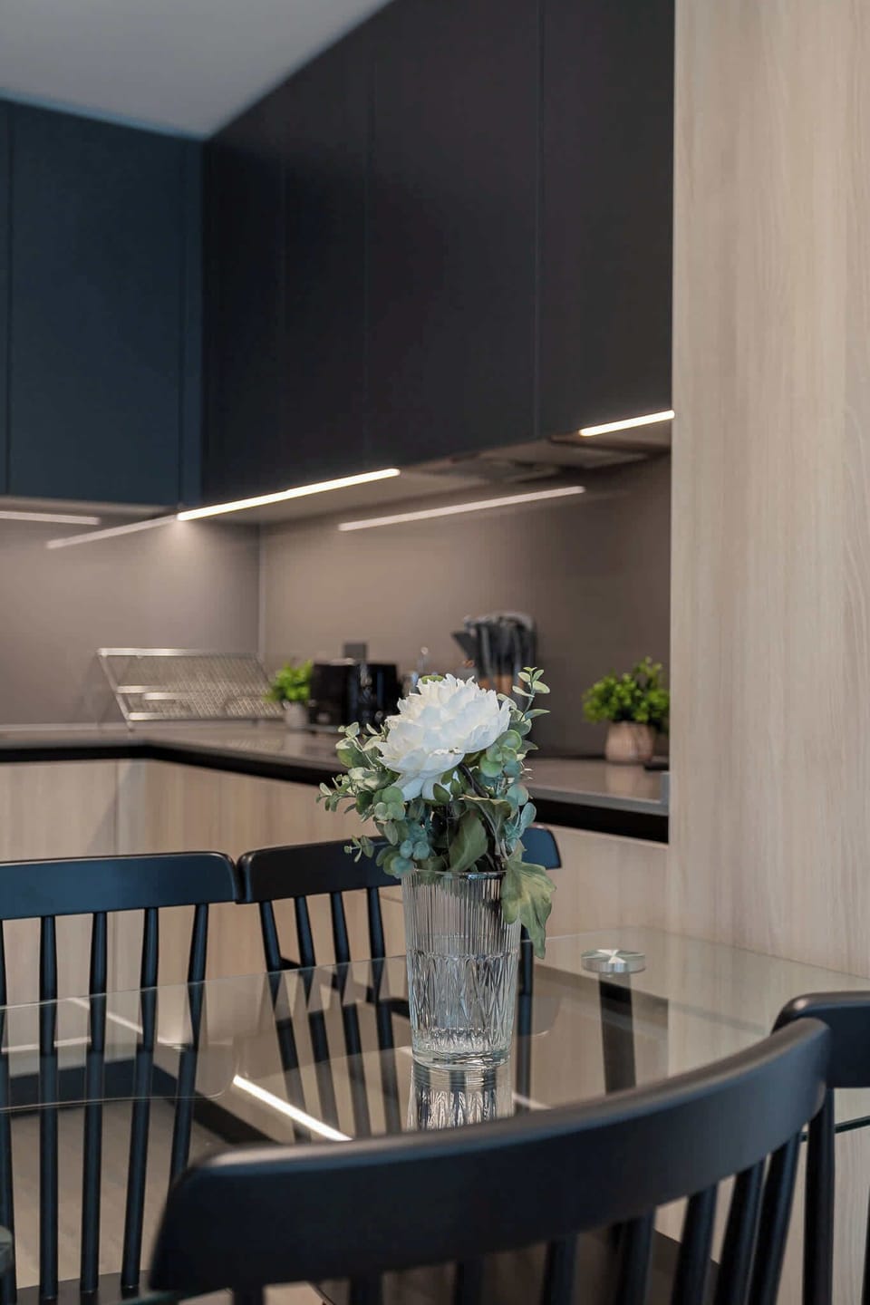 Experience modern elegance in this stylish kitchen, perfect for culinary adventures and cozy gatherings.