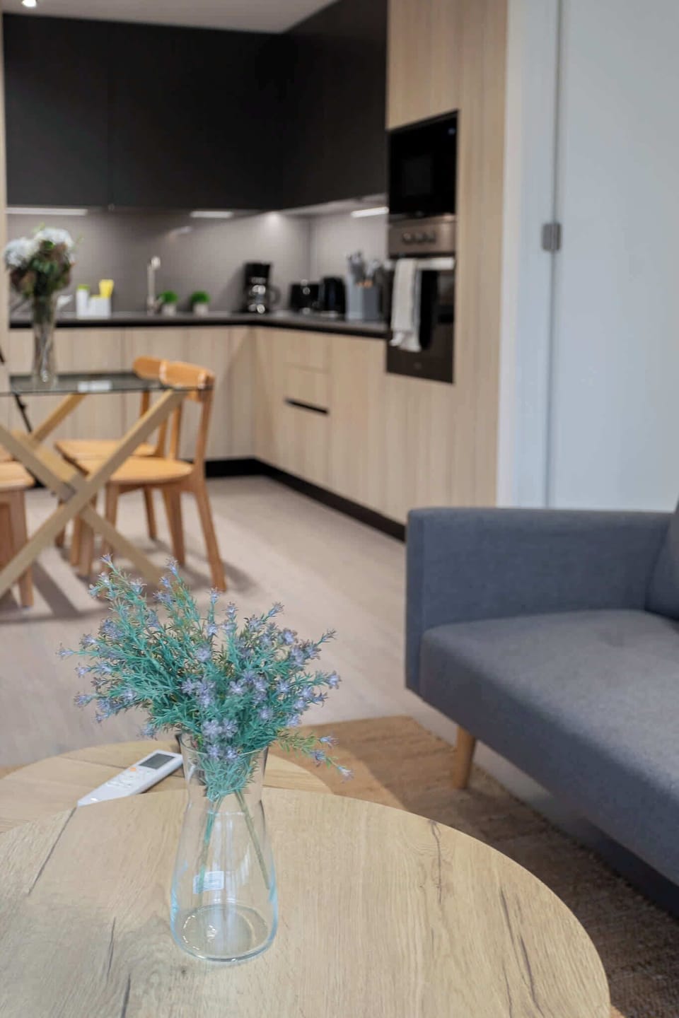 Experience modern living in this stylish kitchen, featuring sleek appliances and a cozy dining area perfect for meals and gatherings.