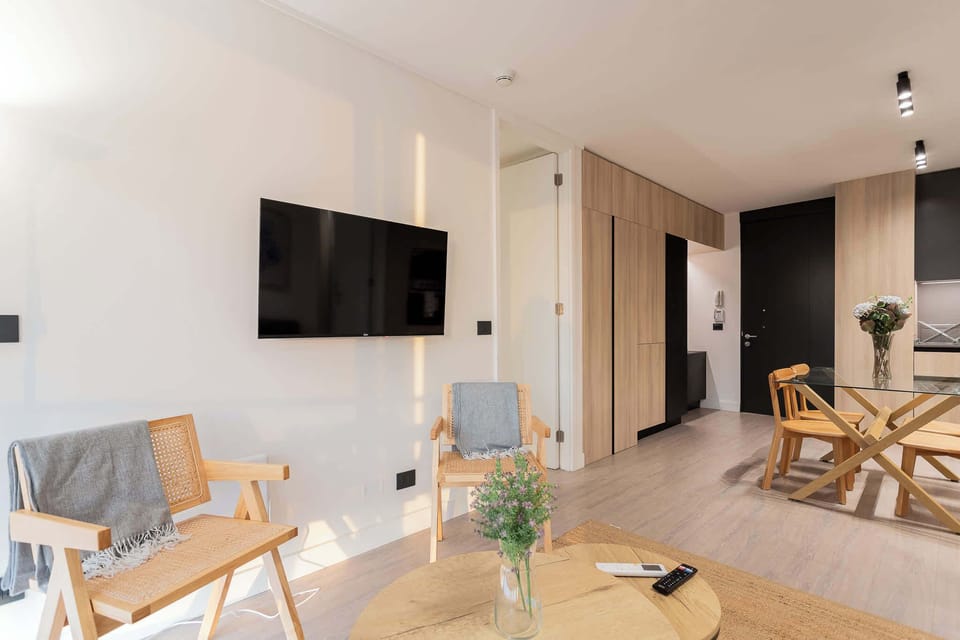 Experience modern comfort in this stylish living space, complete with cozy seating and a sleek design, perfect for relaxation after a day of adventure.