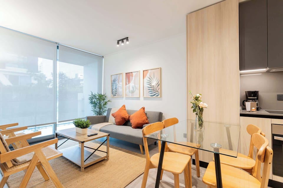 Inviting living space with modern decor and ample natural light, perfect for relaxation and socializing.