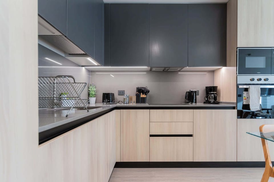 Experience a sleek, modern kitchen equipped with top-notch appliances and stylish finishes, perfect for your culinary adventures!