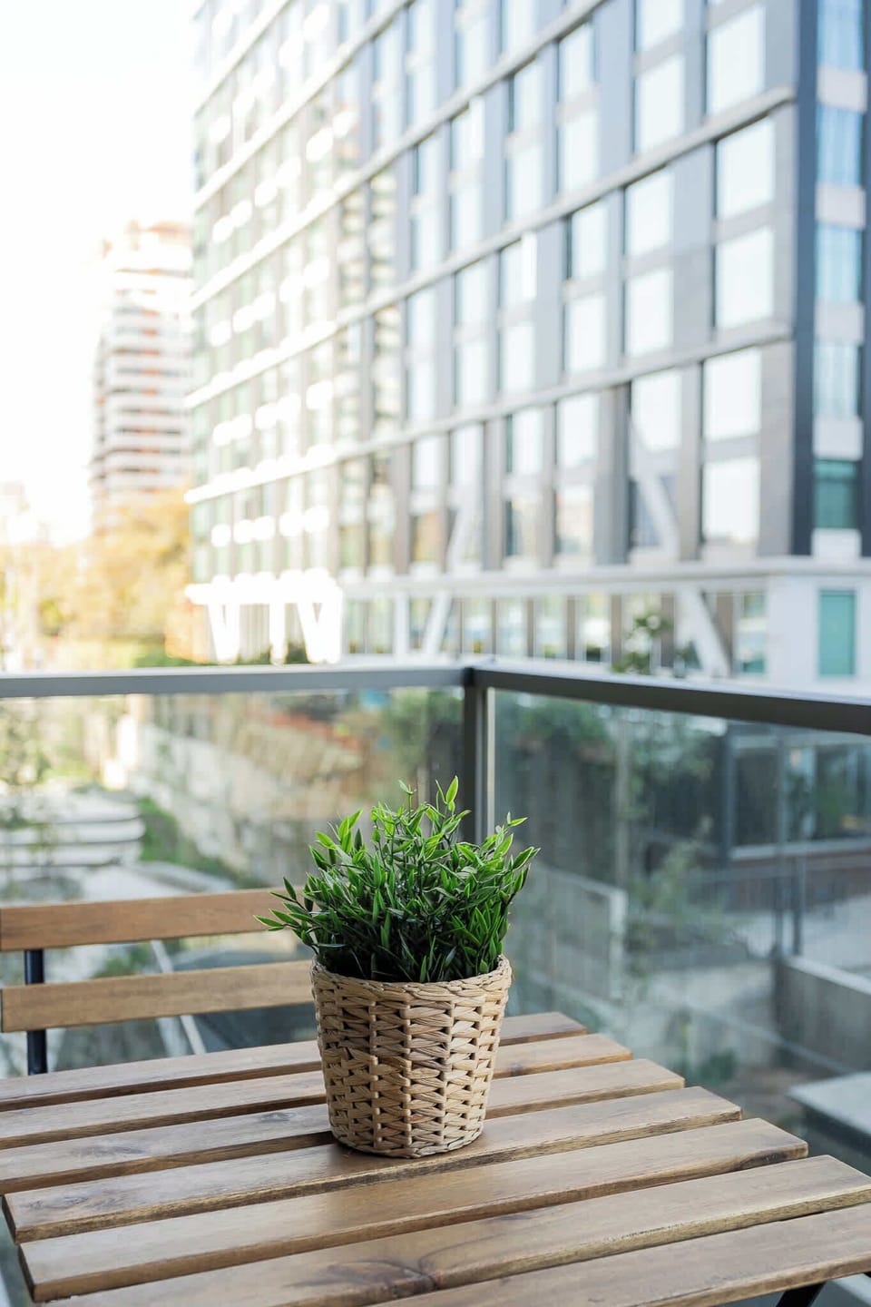 Relax on your private balcony with stunning city views and a touch of greenery.
