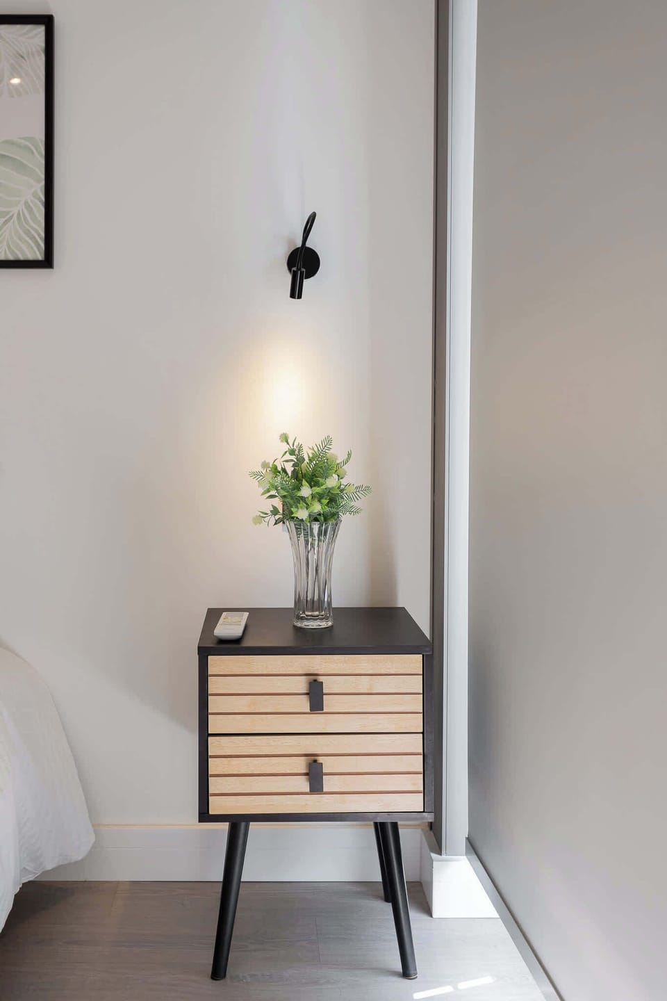Relax in style with modern furnishings and soft lighting in this cozy bedroom retreat.