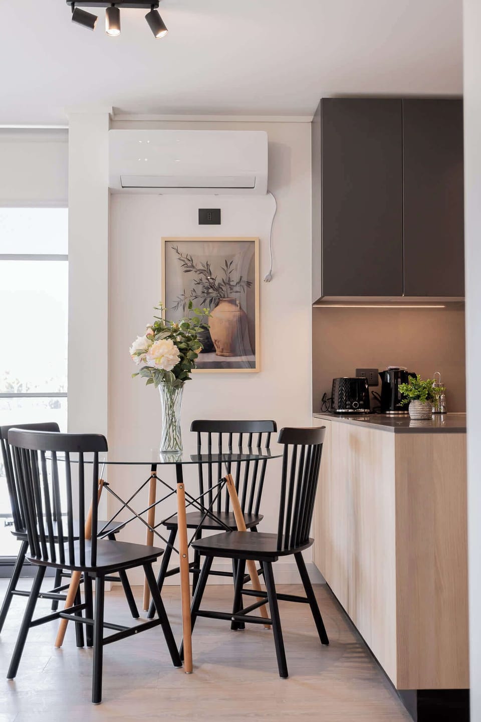 Chic dining area with modern amenities, perfect for intimate meals in a stylish setting.