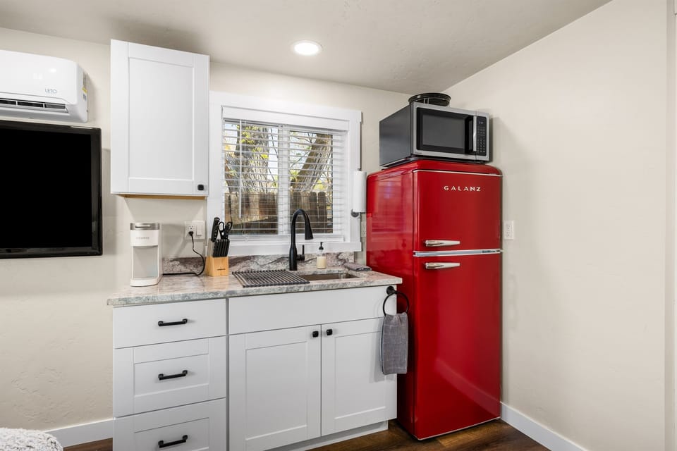 Fully stocked kitchenette complete with plug in cooktop.