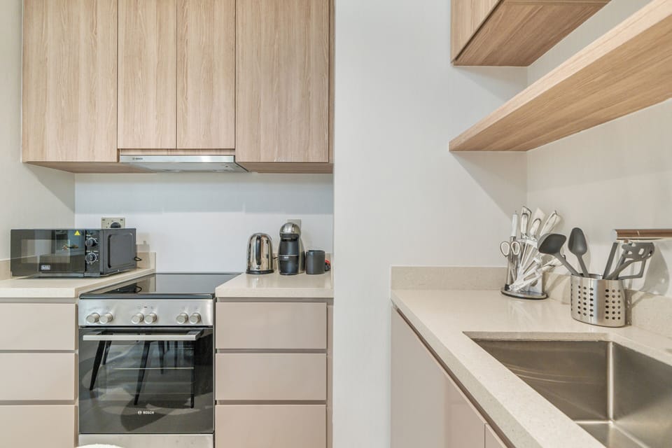 Apartment, Balcony, City View | Private kitchen | Espresso maker, electric kettle