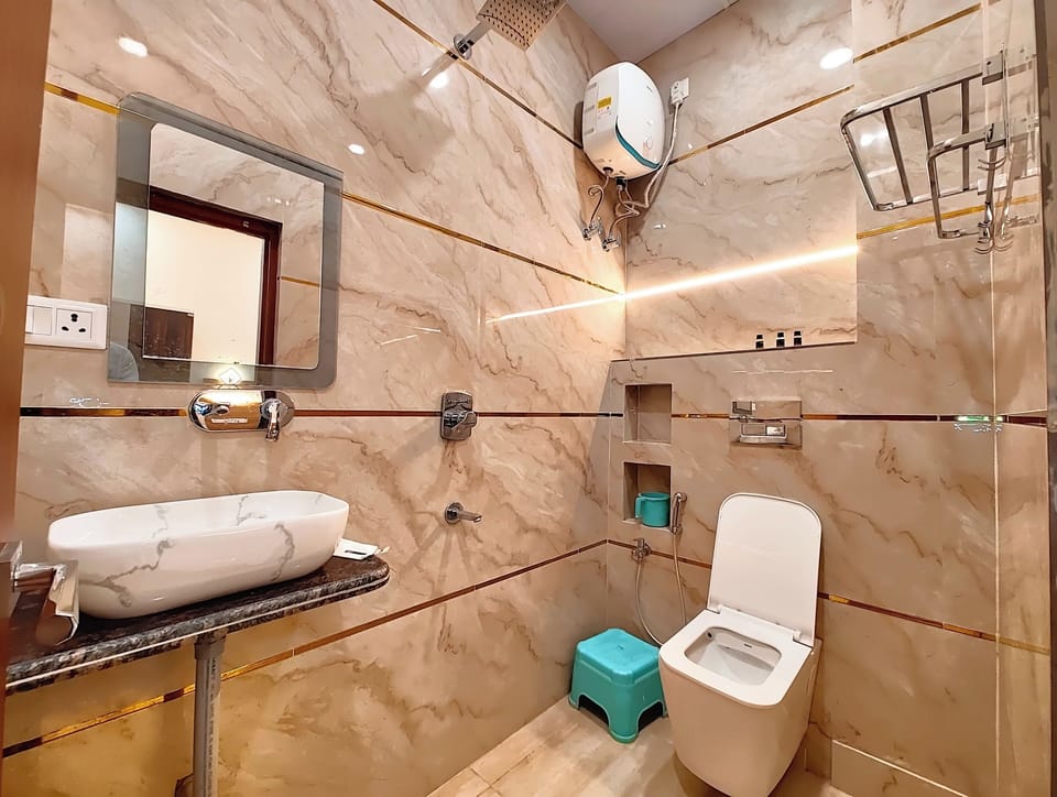 Shower, rainfall showerhead, designer toiletries, slippers