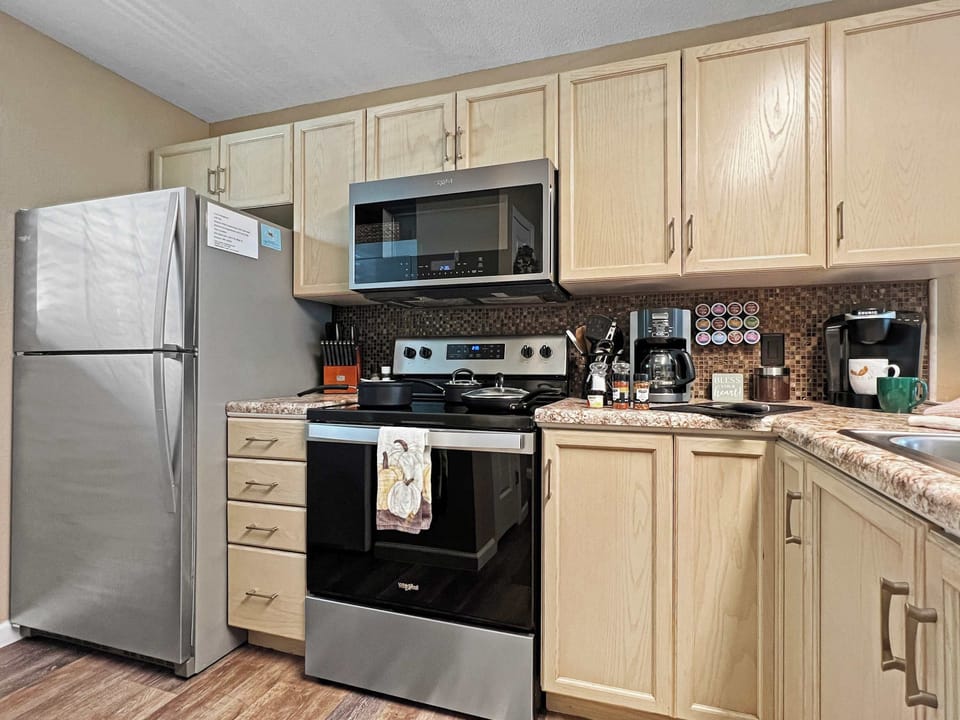 Beautiful kitchen with all appliances, coffee makers, pots, pans and all of the necessary essentials.  
