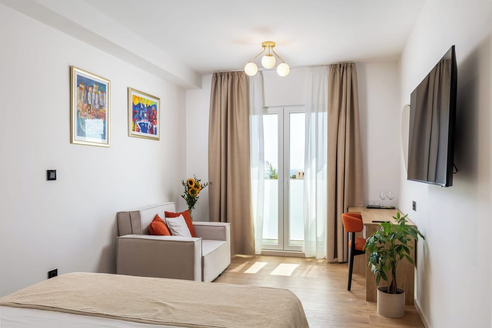 Double Room, Partial Sea View | Hypo-allergenic bedding, memory foam beds, minibar, desk