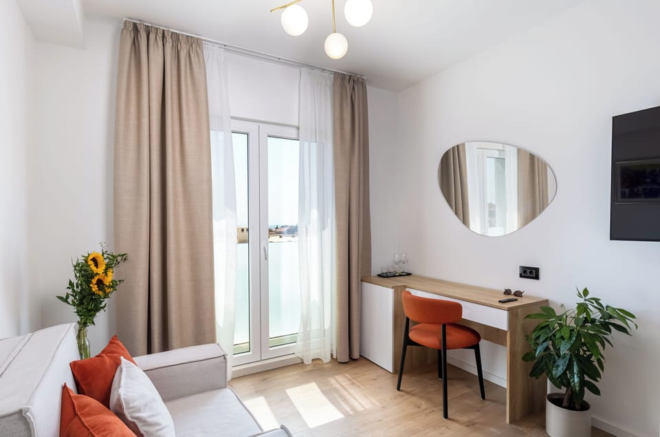 Double Room, Partial Sea View | Hypo-allergenic bedding, memory foam beds, minibar, desk