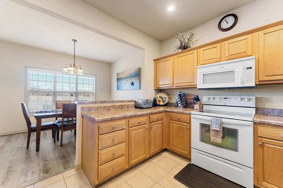 The inviting kitchen offers ample space & every home comfort