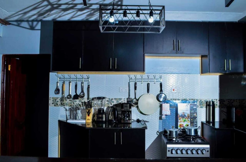 Family Bungalow, Garden View | Private kitchen | Fridge, microwave, cookware/dishes/utensils