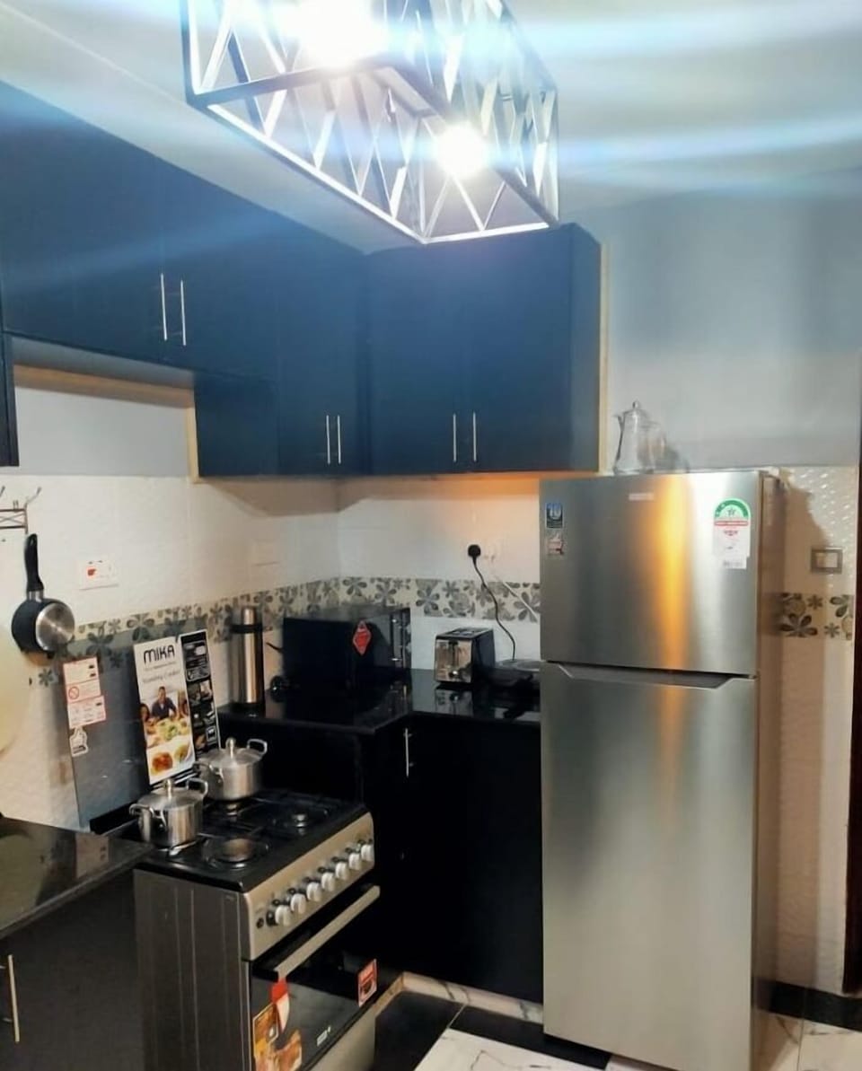 Family Bungalow, Garden View | Private kitchen | Fridge, microwave, cookware/dishes/utensils