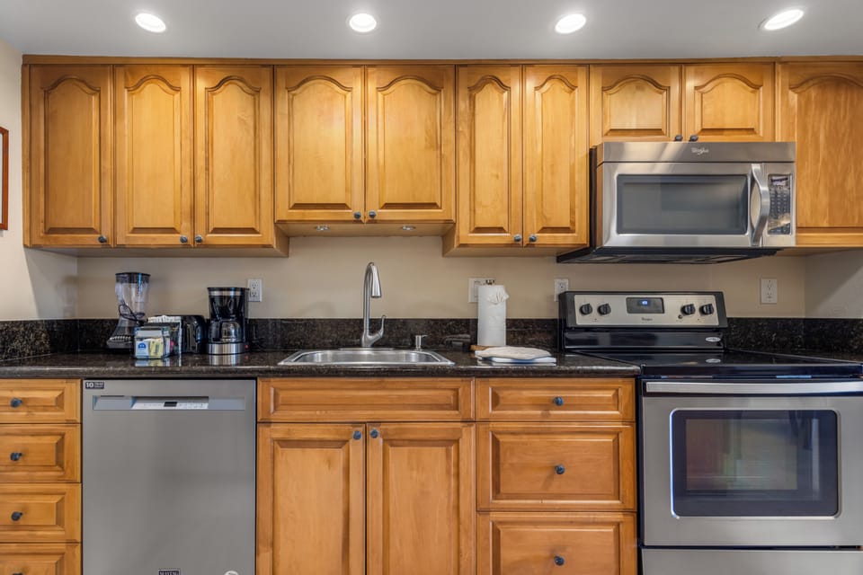 Your fully equipped kitchen features stainless steel appliances, granite countertops, and abundant cabinet storage—perfect for preparing your favorite meals during your stay.