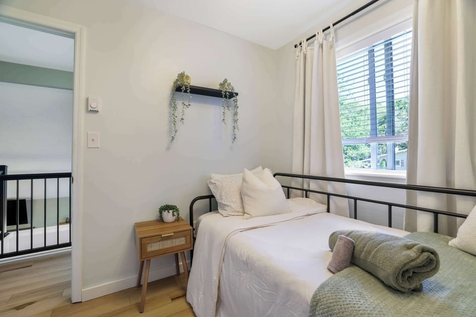 Comfortable, bright, and thoughtfully styled, this bedroom gives you a quiet place to recharge between adventures.