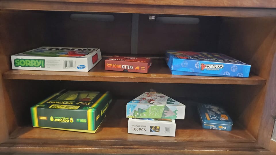 You'll find a selection of games and puzzles in the living room TV stand.