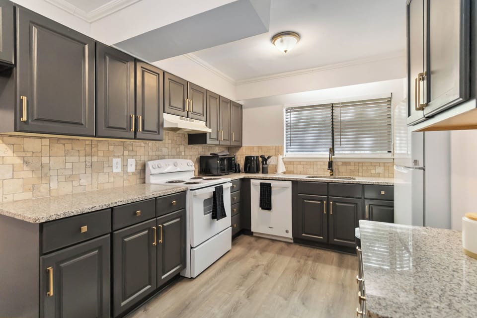 Fully stocked kitchen with modern appliances and ample counter space.