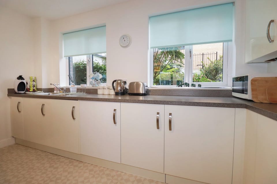 Fridge, microwave, toaster, cookware/dishes/utensils