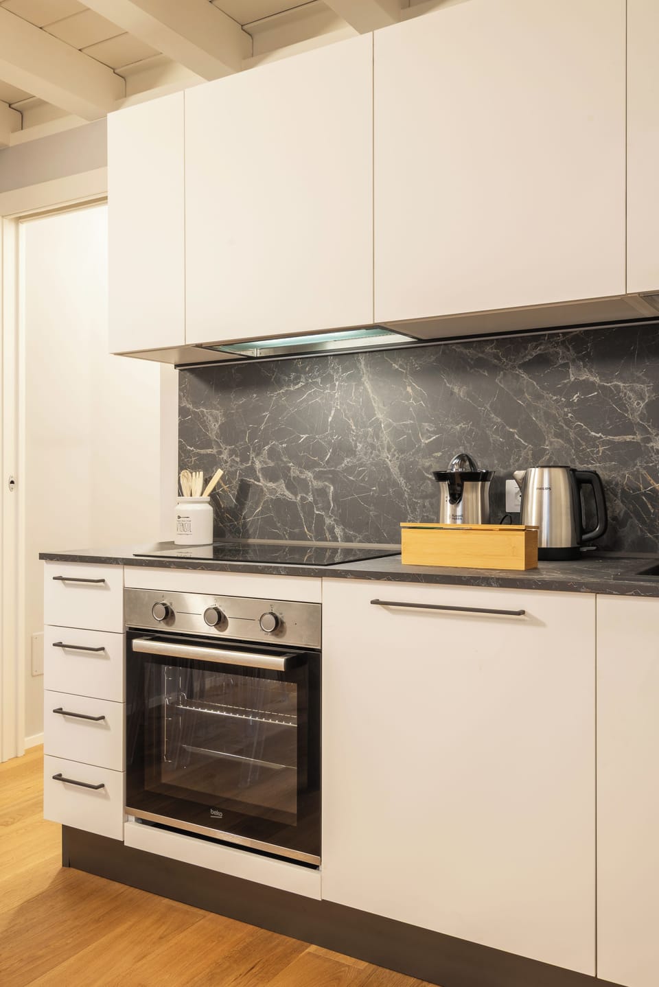 The full kitchen (with Nespresso machine, microwave, oven, kettle, juicer)