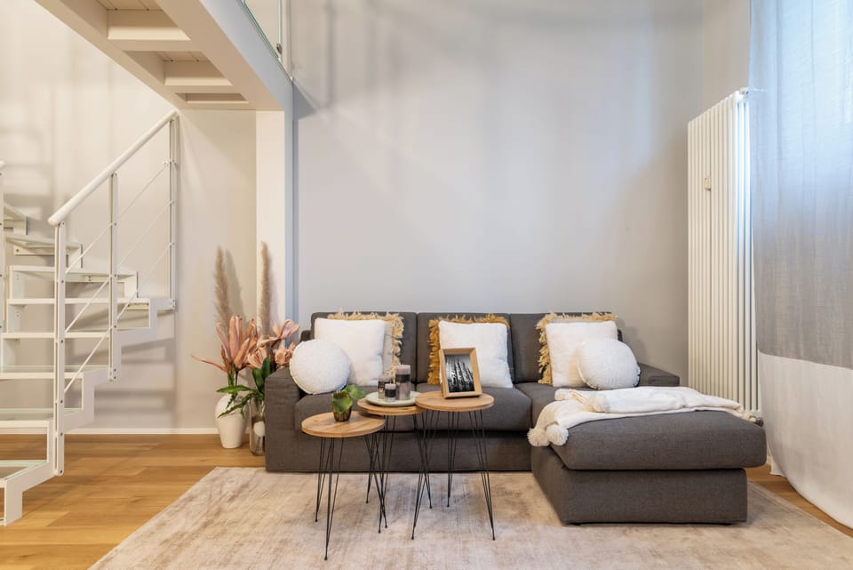 The living-room (with black-out blinds and AC) and access to the upper floor