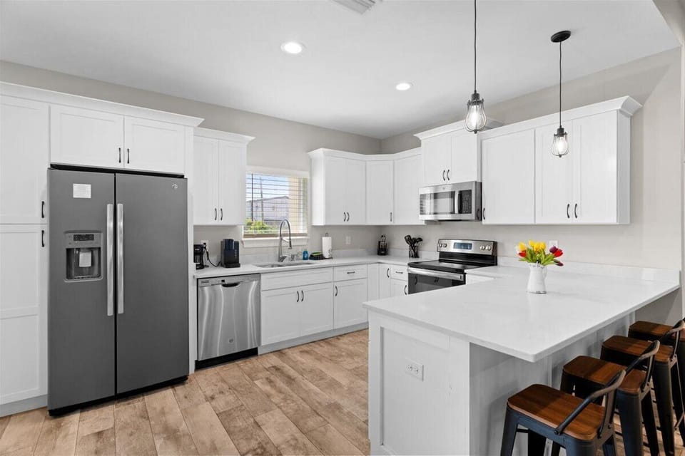Fully equipped kitchen with stainless steel appliances
