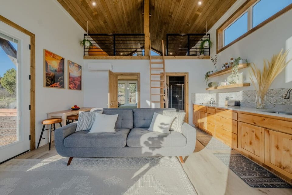 Living room and kitchen with a view to the loft.