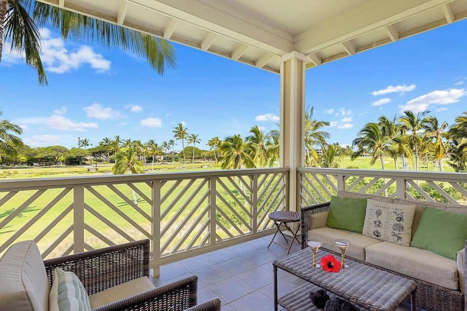 Enjoy drinks and conversation on the breezy balcony with scenic golf course views.