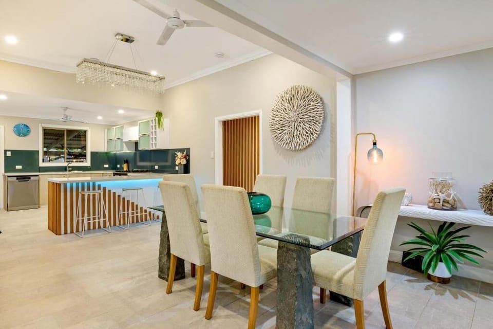 Share long breakfasts and relaxed evening meals around the dining table, perfectly positioned beside the kitchen for easy entertaining.