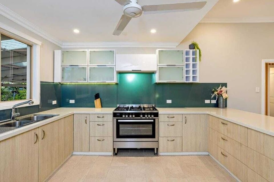 Prepare everything from quick morning coffees to family dinners in the well-equipped kitchen, where ample bench space and quality appliances make cooking effortless.