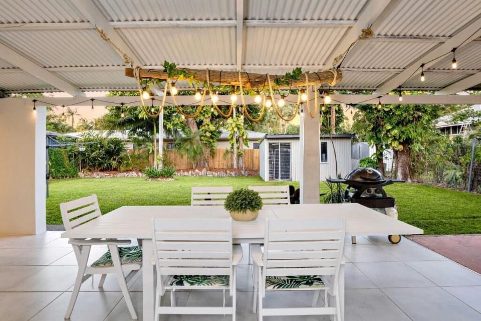 Gather beneath the covered outdoor area for casual drinks, shared meals, or relaxed evenings enjoying the tropical breeze.