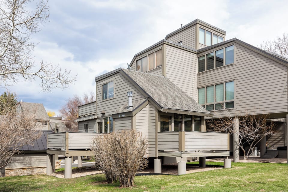- Mountain retreat exterior with unique multi-level design and deck space  
- Surrounded by trees and natural scenery for a private getaway  
- Elevated layout adds charm and perfect cabin-style atmosphere