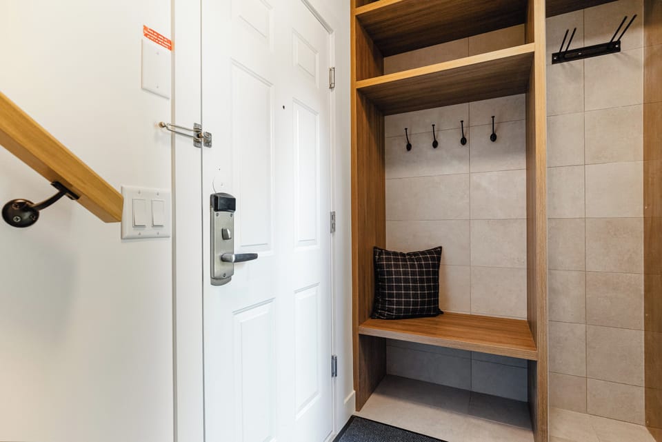 Entryway - with boot heater and ski racks/gear storage leads upstairs to the main living area.