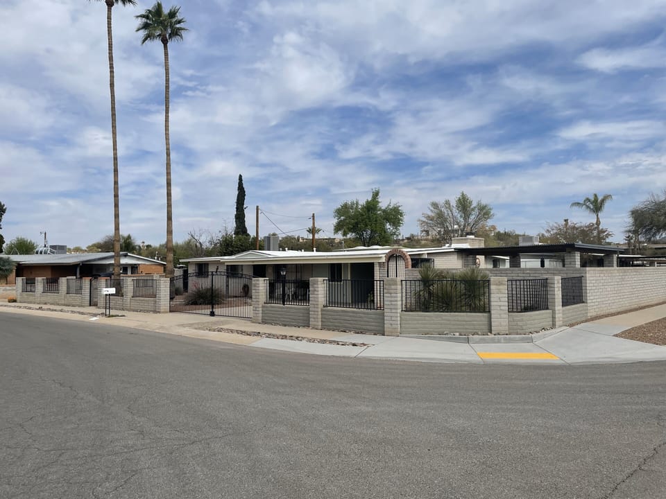 Property on corner lot, carport, fenced and gated.  Windows safety gated.
