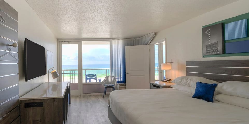 Wake to ocean-blue views from plush beds and breezy comfort.